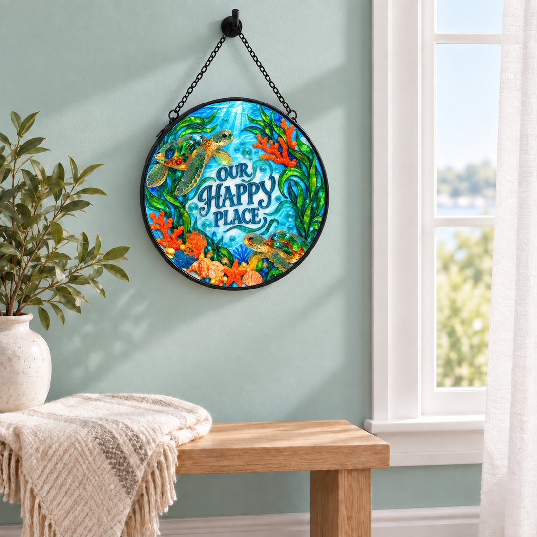 Indoor window display of Our Happy Place Sea Turtles round hanging art